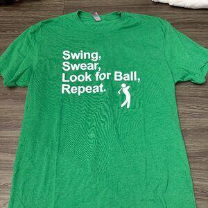 Next Level Green Golf Humor Graphic T-Shirt "Swing, Swear, Look for Ball"